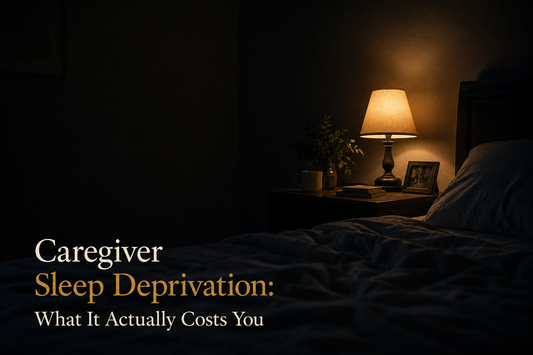 A single lamp lit in a dark bedroom, representing a caregiver lying awake at night.