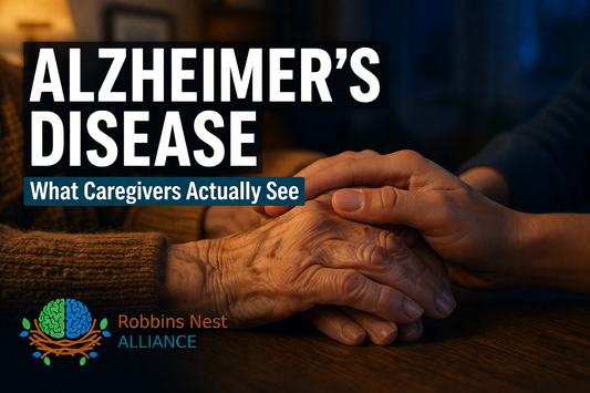 Caregiver holding the hand of a loved one with Alzheimer's disease — dementia caregiver support resource from Robbins Nest Alliance.